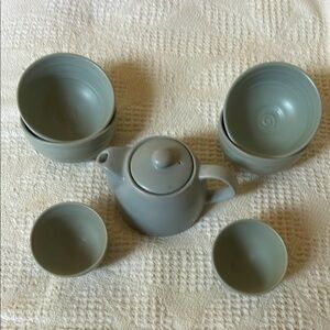 Eight piece tea set; light green color; tea kettle w/lid, 2 cup & 4 bowls.